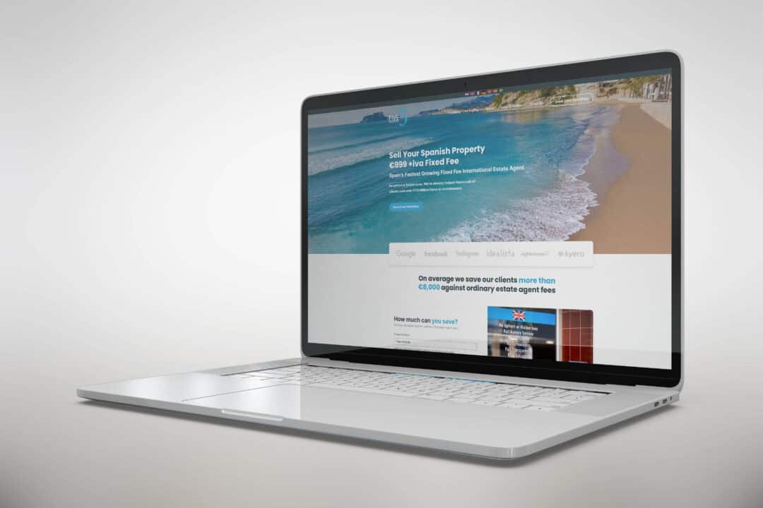 The 5 Real Estate homepage on a laptop screen